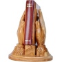 praying hands carrying bible